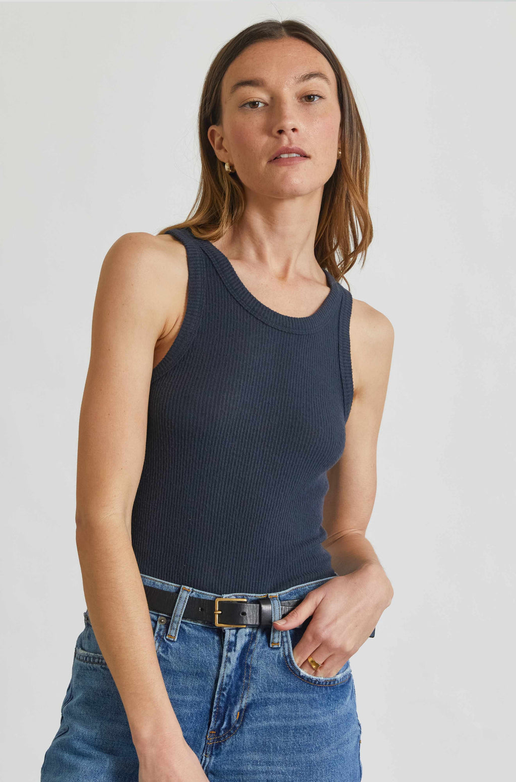 Woman wearing a navy blue tank top